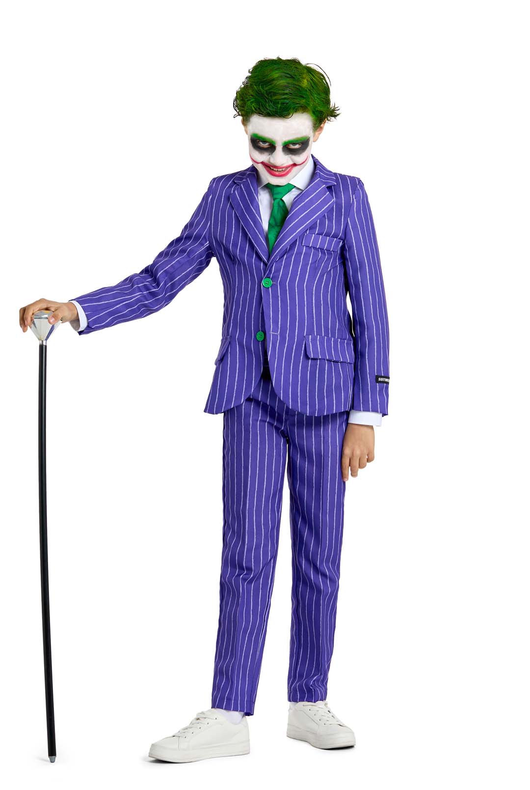 A child dressed in The Joker costume by Suitmeister, featuring a purple pinstripe suit and sporting green hair with clown-like makeup, holds a cane against a white background.