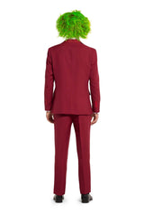 A person wearing a Beetlejuice Groom - Beetlejuice costume from Suitmeister stands facing away, featuring a vibrant green wig, red suit, and black shoes against a white background.