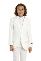 A young person with shoulder-length hair is smiling while wearing the Suitmeister Solid White suit and tie. The background is plain white.