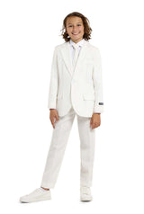 A smiling young person with shoulder-length hair wears a Solid White suit by Suitmeister, a white dress shirt, and tie, complemented with white sneakers as they stand against a plain white background.