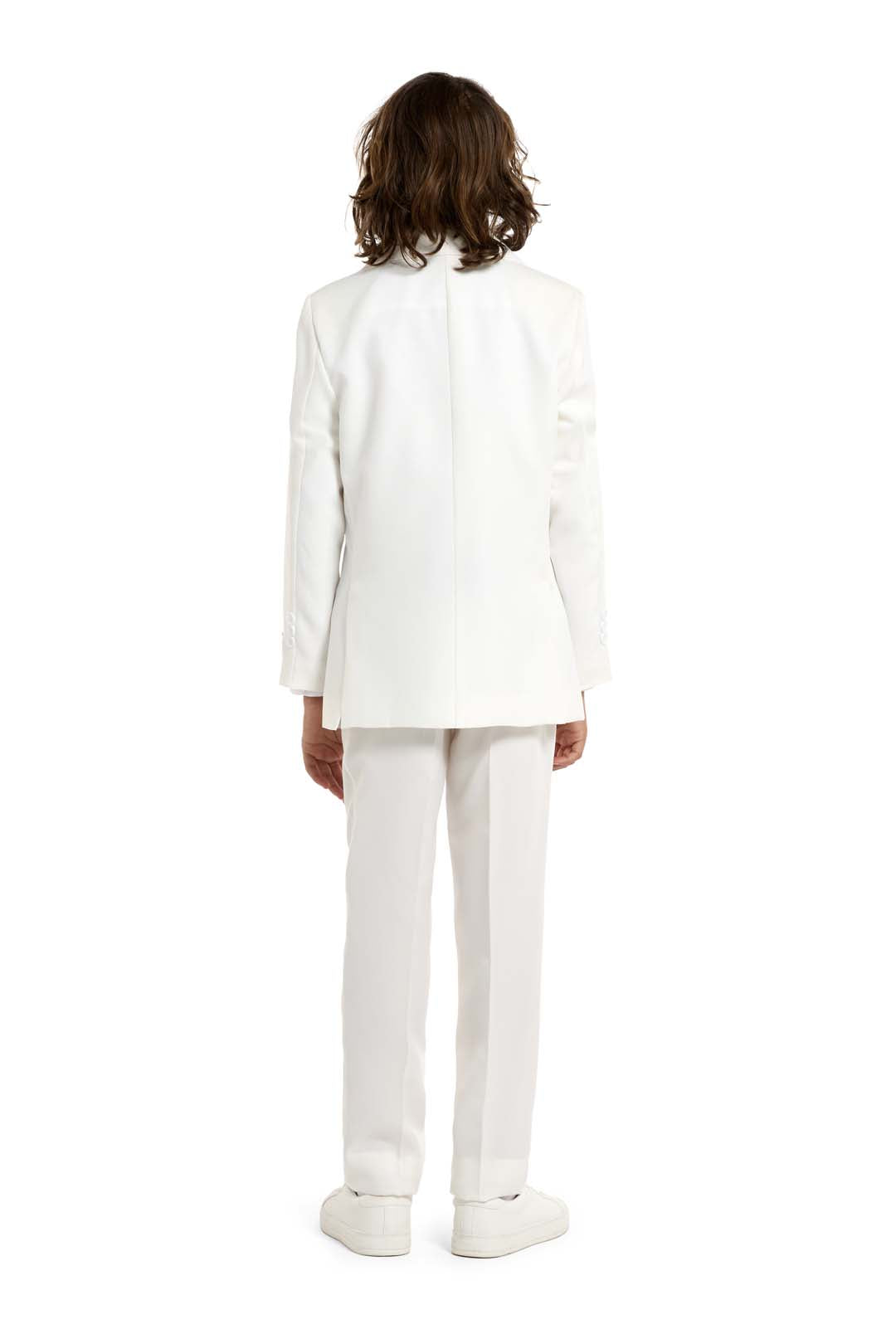 A person with long hair is shown from behind, donning a Suitmeister Solid White suit and matching shoes, set against a plain white backdrop.