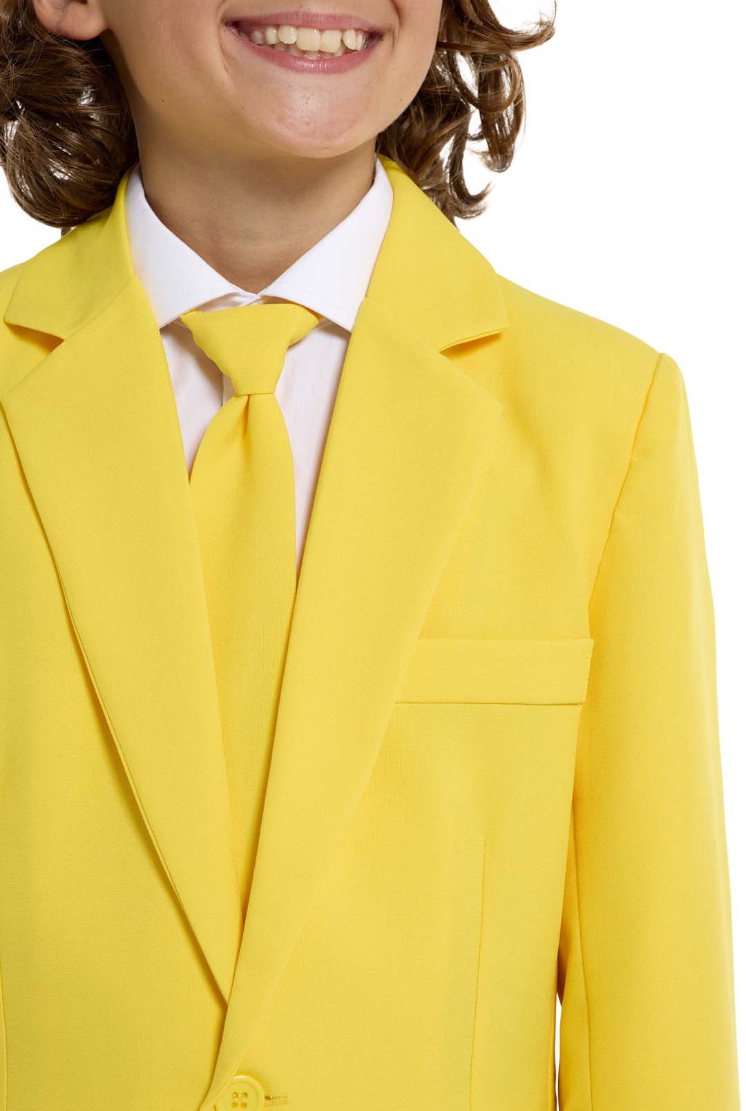 A person with curly hair is partly visible, smiling while wearing the Solid Yellow suit jacket and tie over a white shirt by Suitmeister.