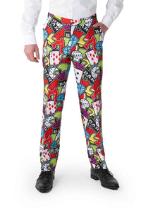 A person is dressed in the Casino Icons suit by Suitmeister, adorned with a vibrant casino-themed pattern that showcases playing cards, dice, and poker chips. They complement the look with a white shirt and black shoes.