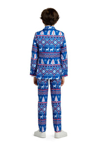 A child is turned away, dressed in the Suitmeister Christmas Blue Nordic suit adorned with festive white and red patterns featuring snowflakes and reindeer. The ensemble is complemented by white shoes, all set against a simple white background.