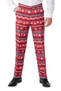 A person dressed in the Suitmeister Nordic Pixel Red Christmas suit, featuring red pants with white and black festive patterns like snowflakes, reindeer, and trees. The ensemble is completed with a white shirt and black shoes.