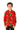 A smiling child wearing the "Suitmeister Christmas Trees Stars Red" shirt, featuring festive Christmas tree and star patterns, stands against a plain white background. This button-up Christmas shirt adds a joyful touch to the scene.