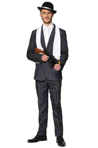 A man wearing the Gangster Pinstripe Black from Suitmeister, complete with a white shirt, black tie, and hat, holds a toy gun. A white scarf is draped over his shoulders as he stands against a plain white background.