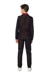 A person with short, dark hair stands facing away in a Suitmeister Harry Potter Gryffindor™ suit, featuring black fabric with red accents. They are wearing white sneakers against a plain white background.