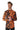 A man wearing the Suitmeister "Halloween Icons" shirt, featuring Halloween-themed patterns in orange and black with motifs like ghosts, skulls, pumpkins, and the word "Boo!" He has short hair and is looking to the side with a slight smile against a plain white background.