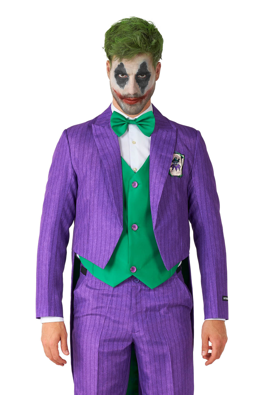 A person dressed in the Joker™ Tailcoat Suit Purple by Suitmeister, featuring a striking purple coat with a green vest and bow tie, paired with a white shirt, and showcasing a colorful painted face.