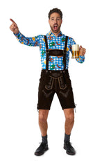 A gentleman wearing the Suitmeister October Check Blue - Octoberfest shirt paired with traditional lederhosen holds a beer mug while gesturing upwards with one hand. He is positioned against a white background.