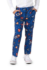 A child wearing the Retro Gamer Navy - Gamer suit by Suitmeister, which features a blue pantsuit with a colorful space-themed pattern including rockets, planets, and pixelated designs. The child is also sporting white sneakers.