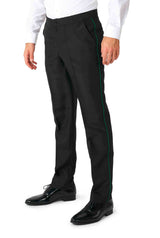 Dressed in the stylish Harry Potter Suit - Slytherin™ by Suitmeister, an individual stands with hands relaxed by their sides. The ensemble features a white shirt and black trousers adorned with a distinctive green stripe along the side, complemented perfectly by shiny black shoes against a plain white background.