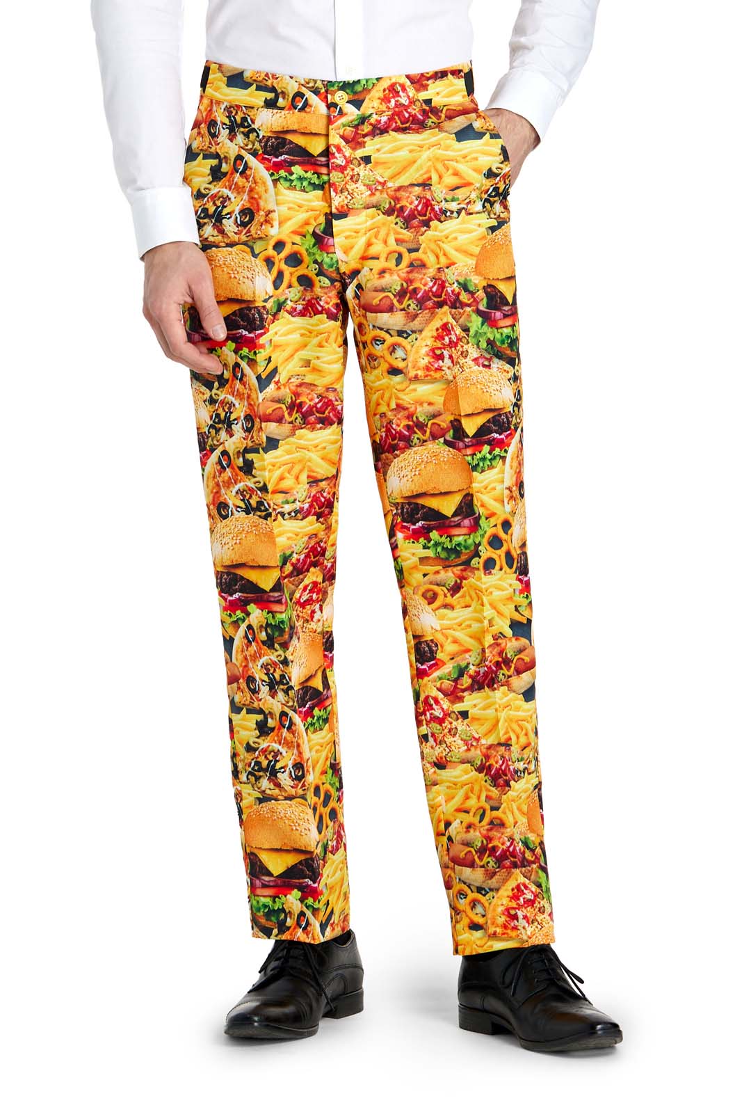 A person is dressed in the Suitmeister Snack Master - Carnival suit, featuring vibrant pants with a playful print of hamburgers, fries, pizza, and other fast food items. They've paired it with a white shirt and black shoes, highlighting the lively food-themed design of the pants.