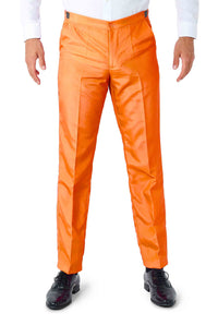 A model showcasing the vibrant Solid Orange Suit by Suitmeister, complemented with a white long-sleeve shirt and black shoes, against a plain white backdrop. The image emphasizes the pants and lower section of the ensemble.