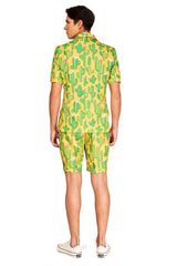 An individual is seen from behind wearing the "Sunny Yellow Cactus - Summer Suit" by Suitmeister, which features a short-sleeved jacket and matching shorts in a vibrant yellow with a playful green cactus design. They have paired it with white sneakers.