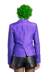 Rear view of a person with curly green hair wearing The Joker Jacket by Suitmeister, black leather shorts, and sheer polka dot tights, standing against a white background.