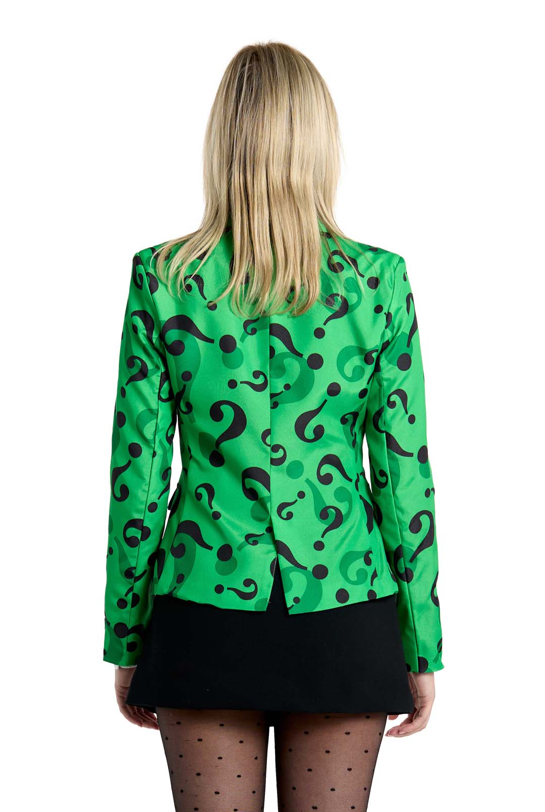 A person with long blond hair, viewed from behind, is wearing The Riddler Jacket by Suitmeister—a green blazer adorned with black question marks. Their ensemble is finished off with a black skirt and sheer black tights.