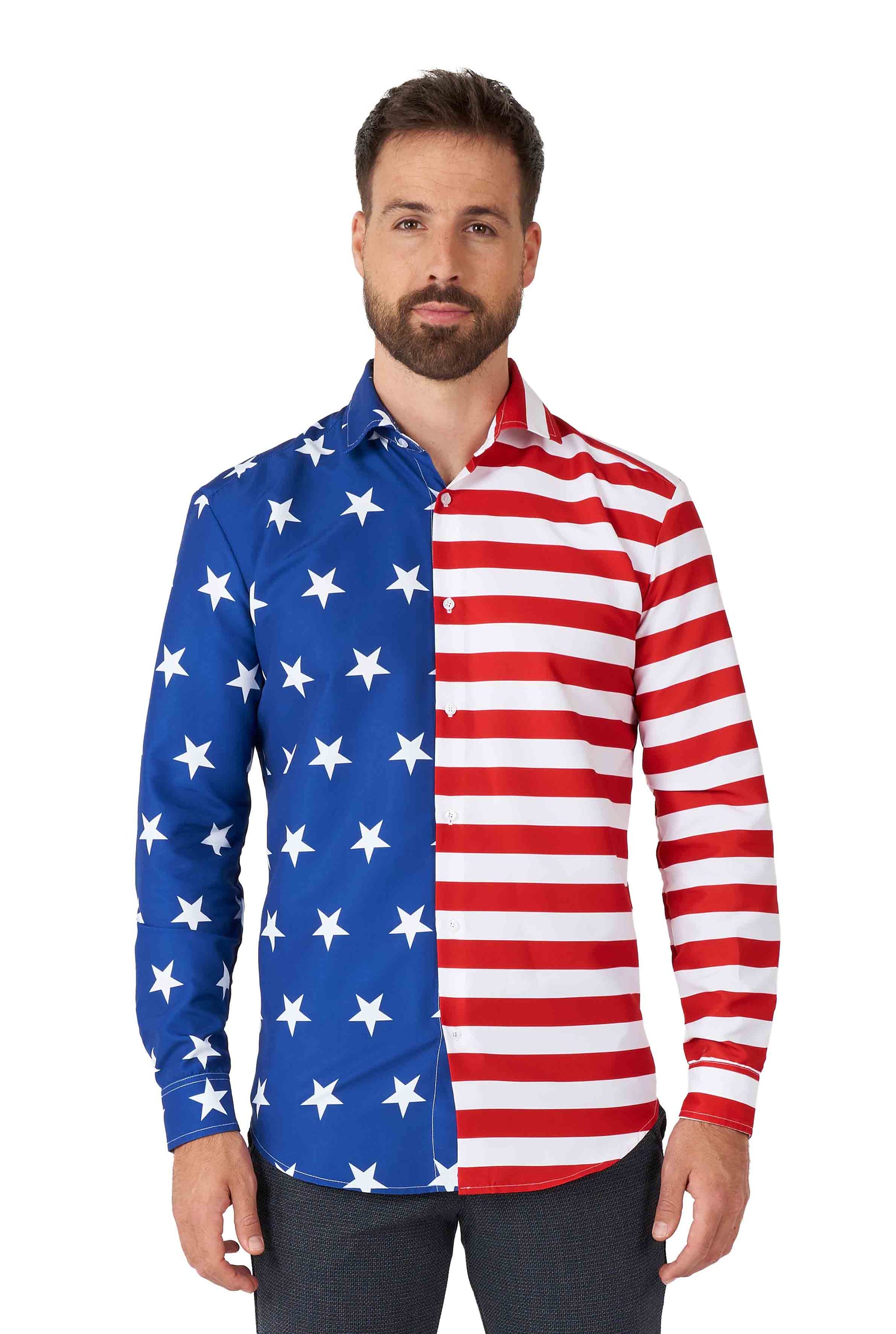 A man with a beard is wearing the USA Flag shirt by Suitmeister, which showcases a design inspired by the American flag, featuring one half in blue with white stars and the other half in red and white stripes. He stands against a plain white background.