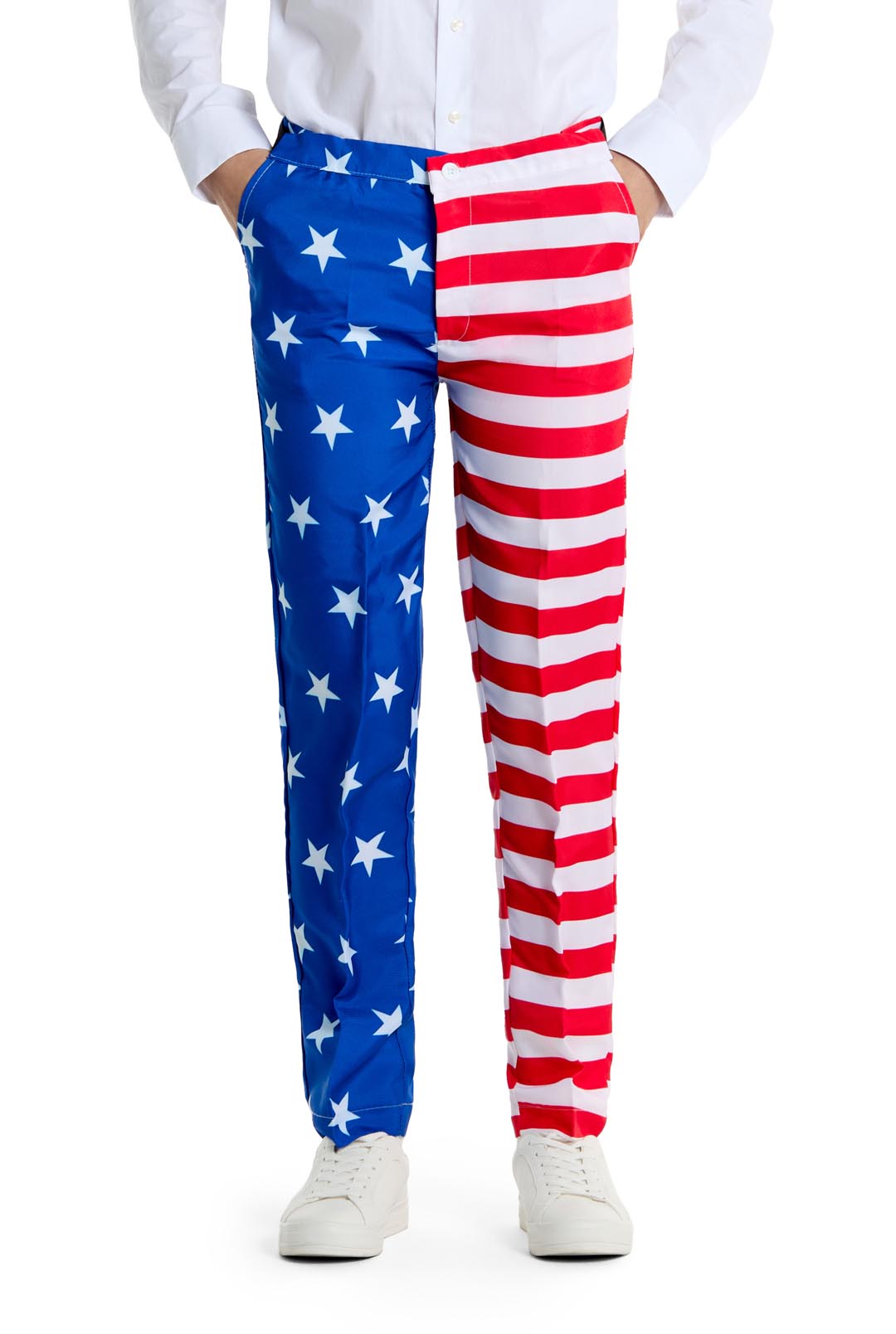 A person is dressed in the USA Flag - 4th of July outfit by Suitmeister, featuring blue with white stars on the left leg and red and white stripes on the right, complemented by a white shirt and matching white sneakers. Their hands are casually tucked into their pockets.