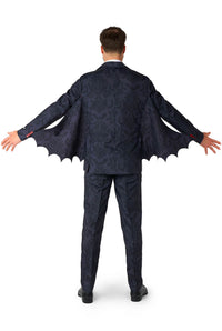 A person is shown from the back with arms extended, wearing the Suitmeister Victorian Vampire Suit Black. The suit has bat-like scalloped wings attached, giving off a Halloween or costume vibe.