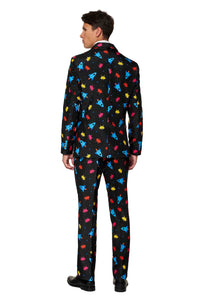 A person is wearing the Suitmeister Videogame - Game suit, which features a black base with vibrant retro video game graphics, including red, yellow, and blue space invader-like patterns. The individual is standing with their back to the viewer, highlighting the suit's design.